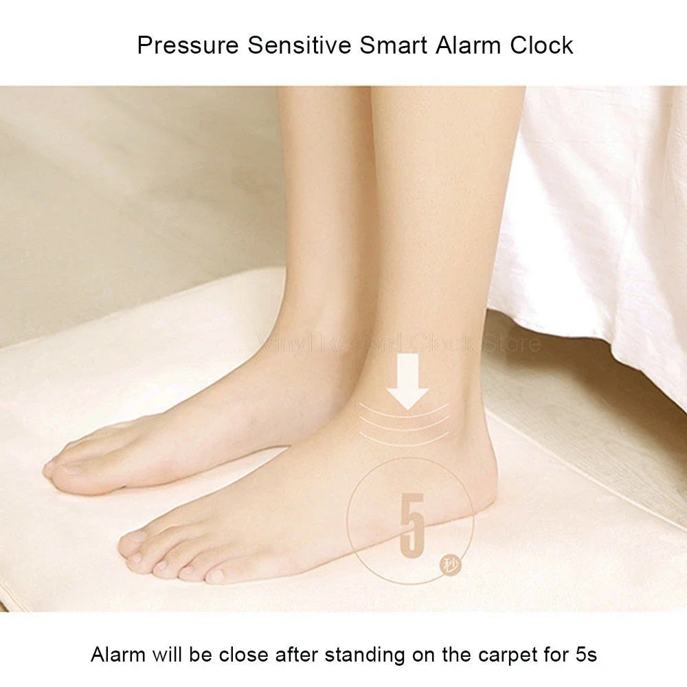 Smart pressure-sensitive alarm clock with LED display and memory foam base for comfortable, refreshing mornings