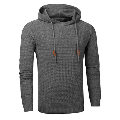 A man wearing a cotton-polyester blend hoodie available in nine colours including black, navy, and red.