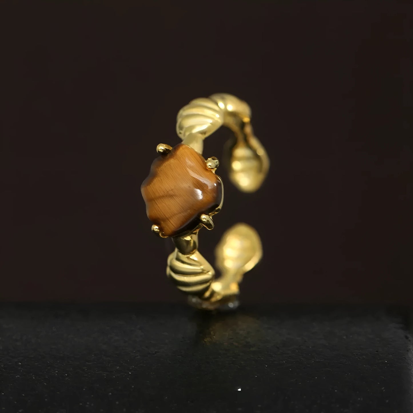 Adjustable silver ring with tiger eye stone centrepiece and shell design in electroplated finish