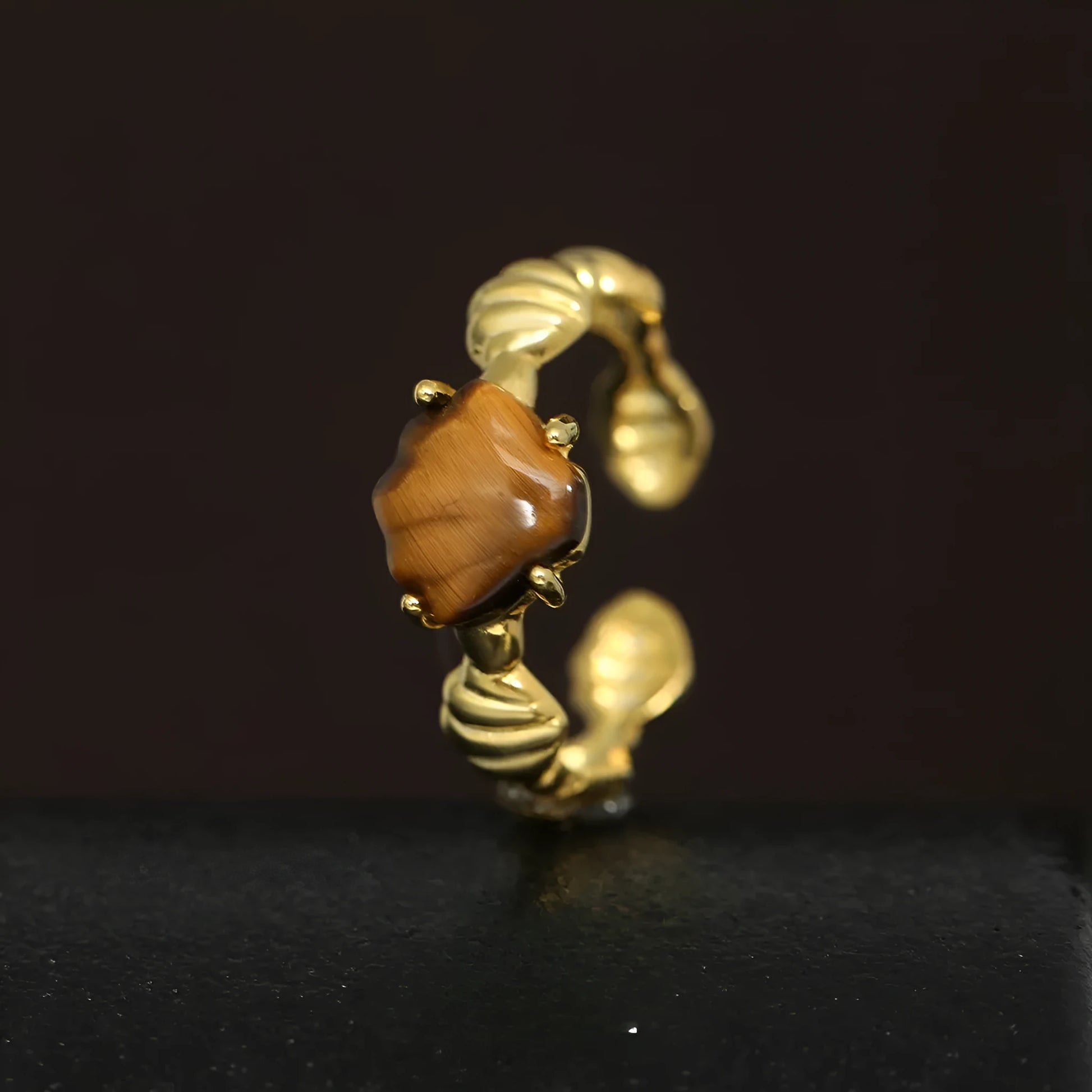 Adjustable silver ring with tiger eye stone centrepiece and shell design in electroplated finish