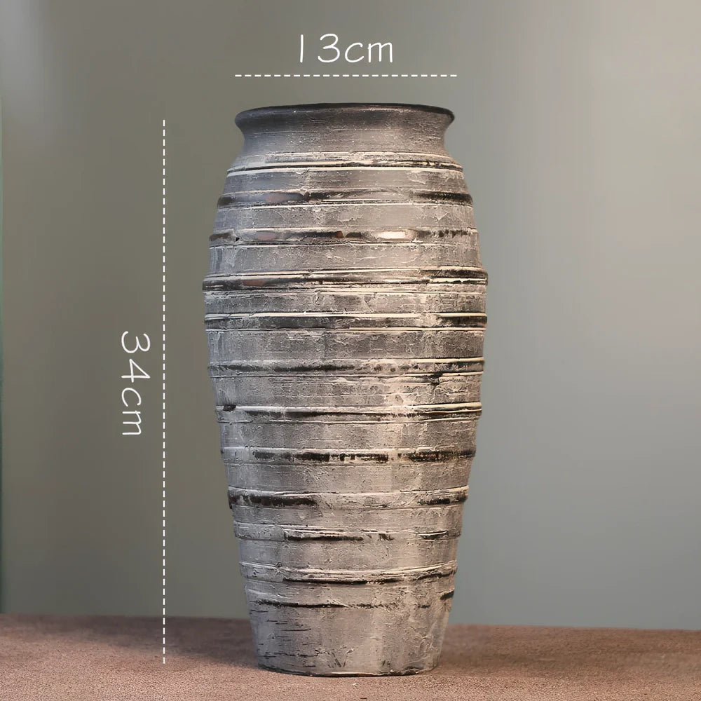 Ceramic mosaic vase with dried flower arrangement, handcrafted surface detailing