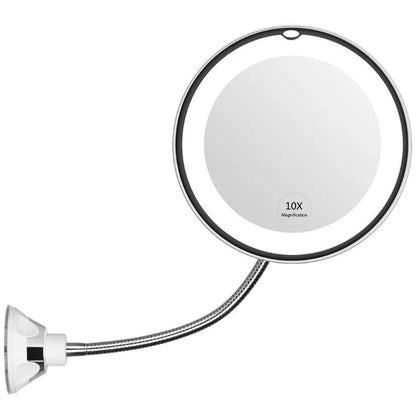 White 10x magnifying LED makeup mirror with flexible gooseneck and suction cup base on a table.