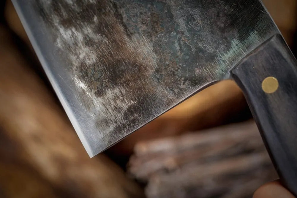 Hand-made stainless steel meat cleaver with a 17cm round head blade on a kitchen surface.