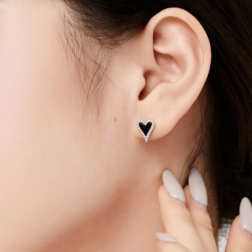 S925 silver heart-shaped stud earrings with black agate and white stone in a cold wind style, one pair