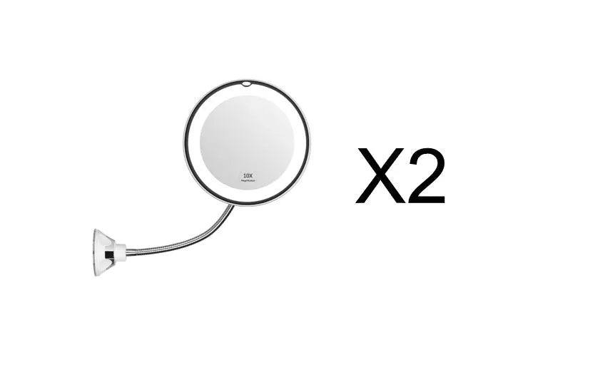 White 10x magnifying LED makeup mirror with flexible gooseneck and suction cup base on a table.