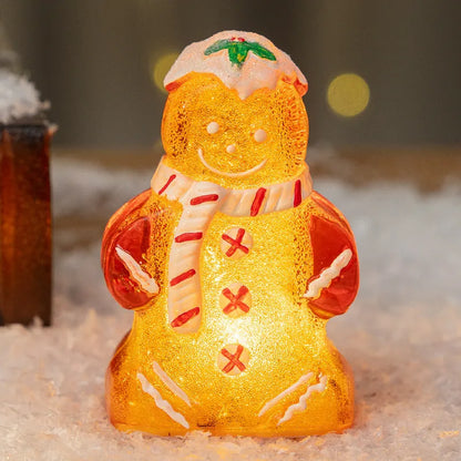 Glowing Christmas gingerbread man and snowman ornaments with LED lights in red, white, and transparent scarf variations