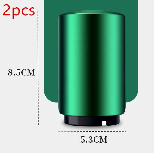 Stainless steel automatic bottle opener measuring 8.4 cm by 5.3 cm on a kitchen counter
