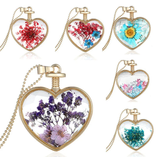 Elegant floral pendant necklace with a dried flower charm on a gold-tone chain