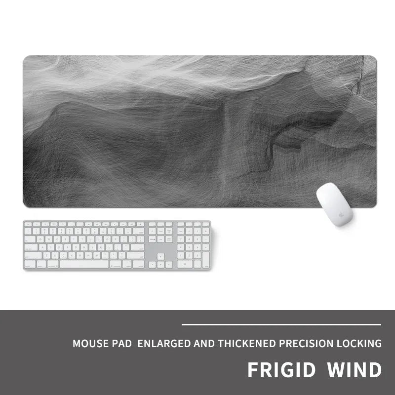 Oversized rectangular mouse pad with a printed design on a desk, next to a keyboard and mouse.