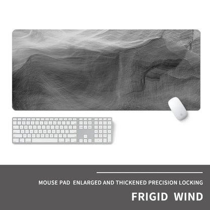 Oversized rectangular mouse pad with a printed design on a desk, next to a keyboard and mouse.