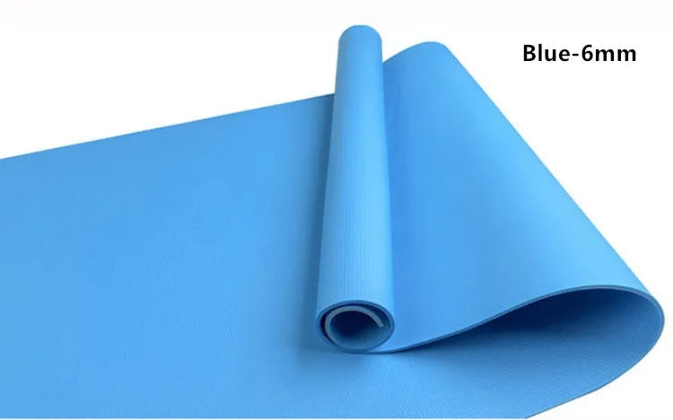EVA composite fitness and yoga mat in blue, showing its texture and rolled edge next to a storage bag.