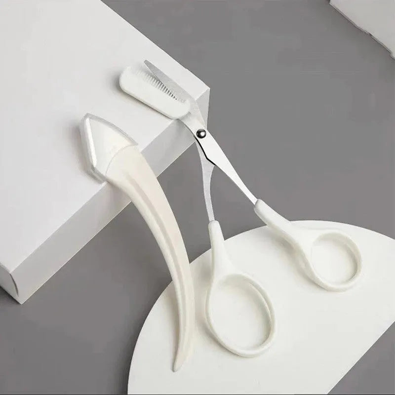A curved moon-shaped eyebrow trimming knife and a cutting comb on a white background.