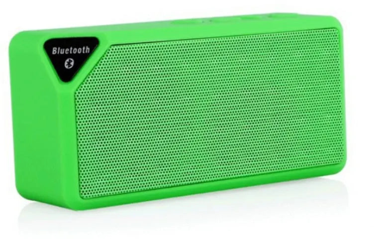 Cannon X3 small cube-shaped wireless Bluetooth speaker in multiple colours on a table.