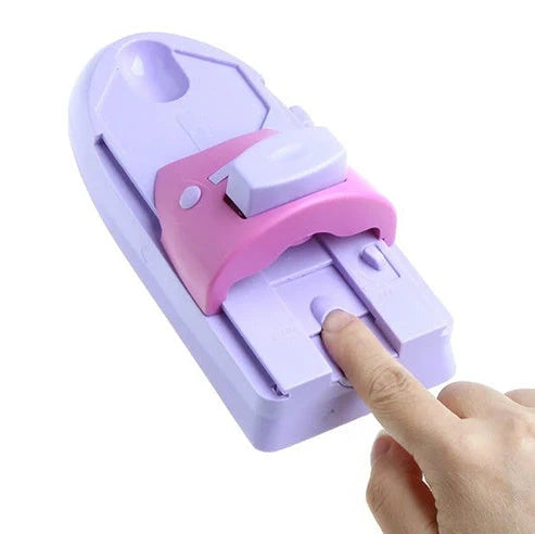 White plastic nail art stamping machine with six stainless steel pattern plates on wooden desk
