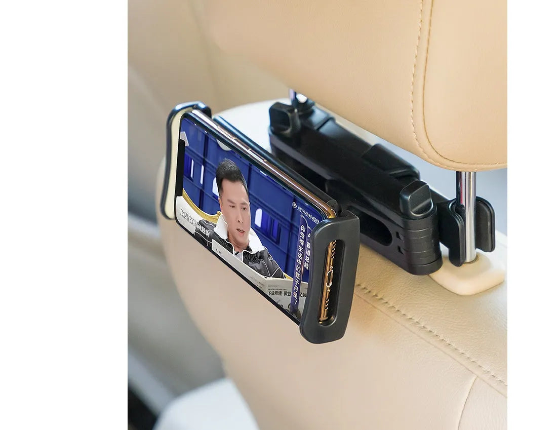 Black car phone holder mounted on vehicle rear seat with tablet secured in snap-in bracket