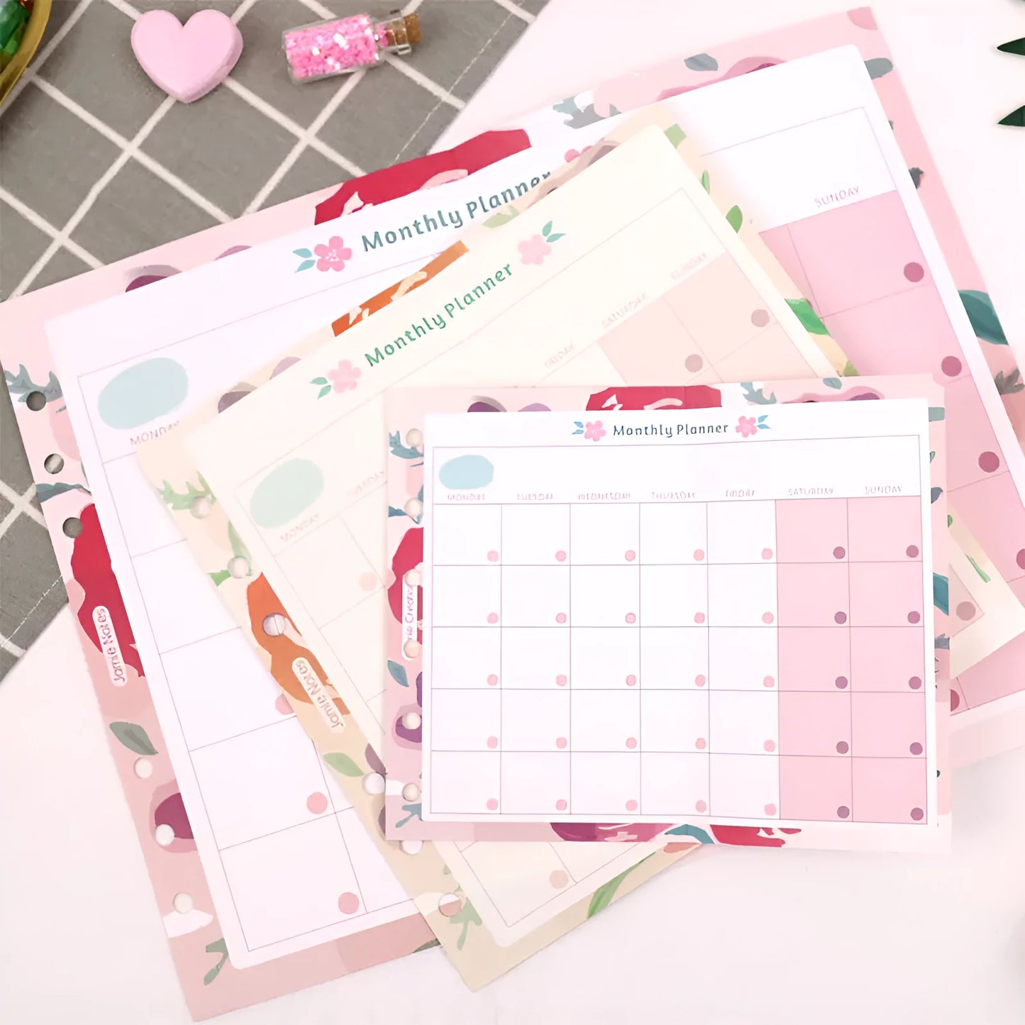 A7, A5, and A6 handbook loose-leaf refill pack showing floral and symphony tri-fold design options.