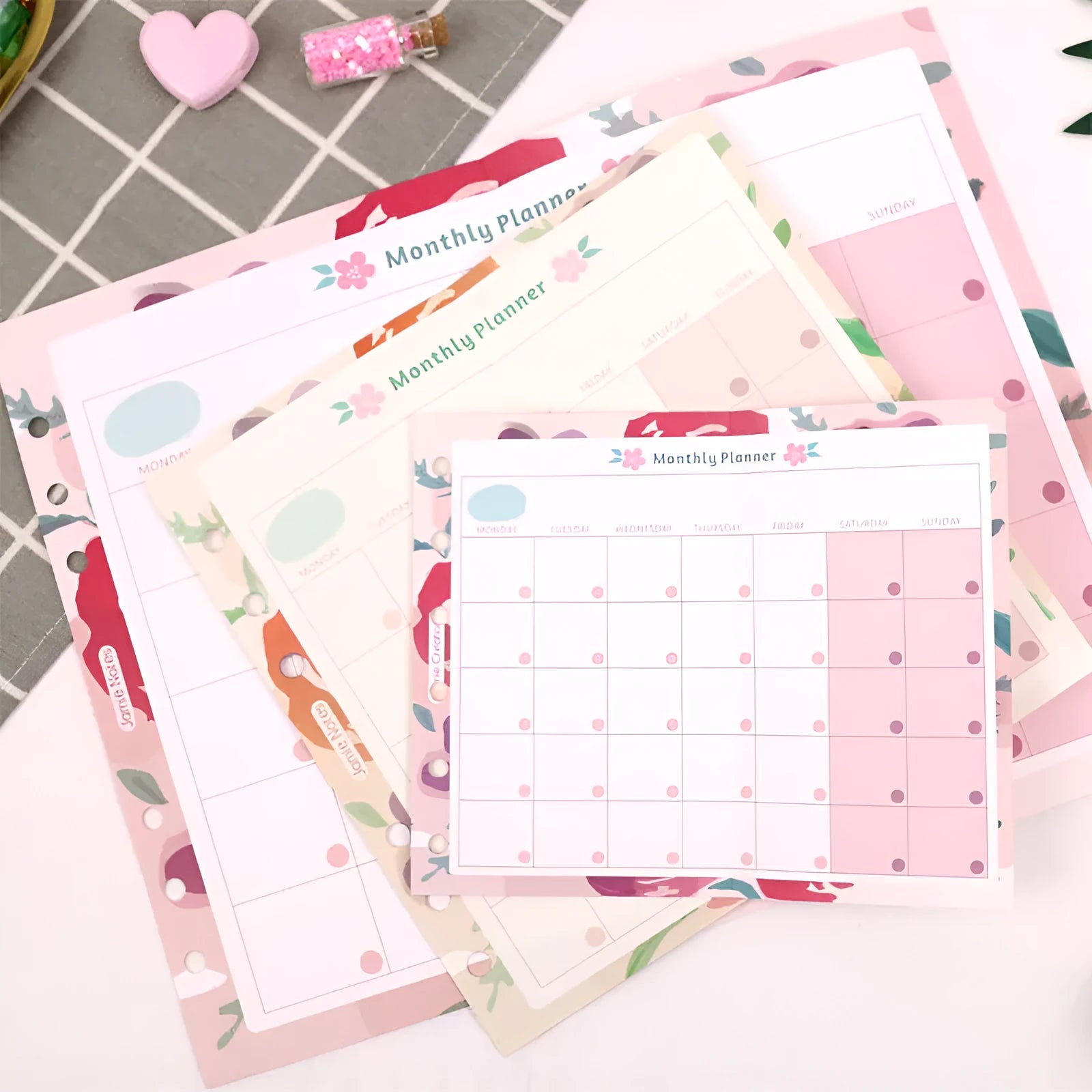 A7, A5, and A6 handbook loose-leaf refill pack showing floral and symphony tri-fold design options.
