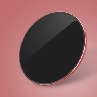 Ultra-thin aluminium wireless charger in rose gold with micro USB port and status light.
