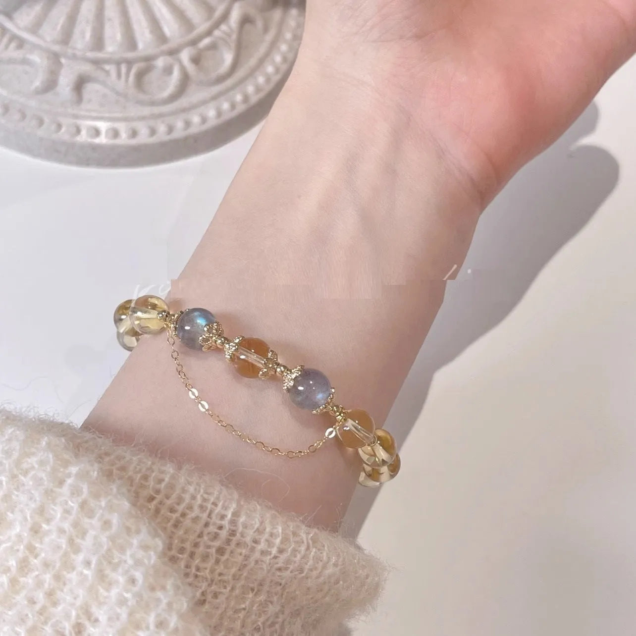 Women's gold electroplated crystal bracelet with moonstone and sunstone stones in Chinese style design.