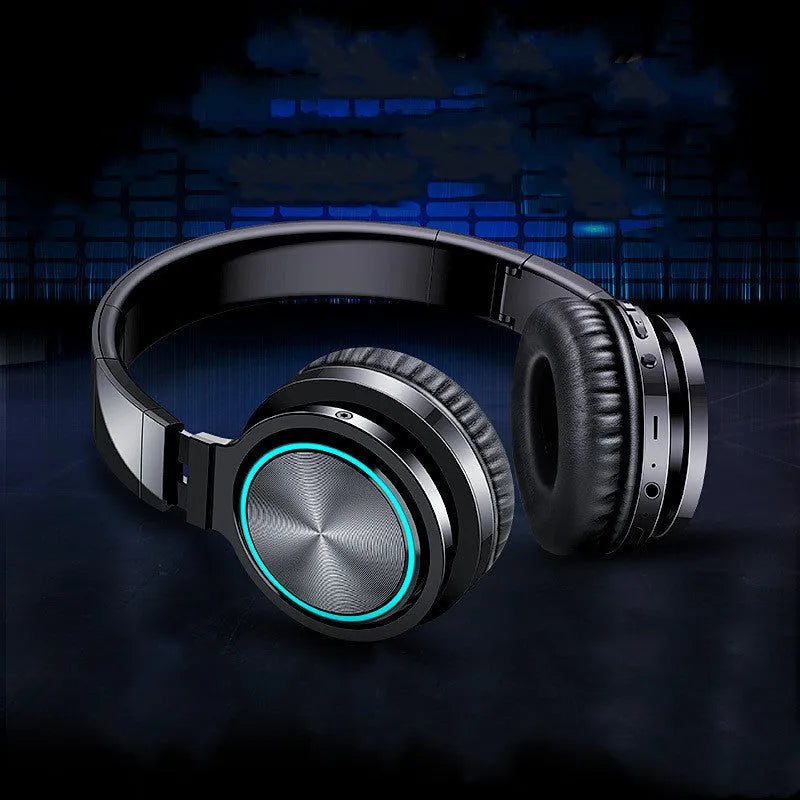 Wireless folding over-ear headset shown in black, black and red, and white and grey colour options.