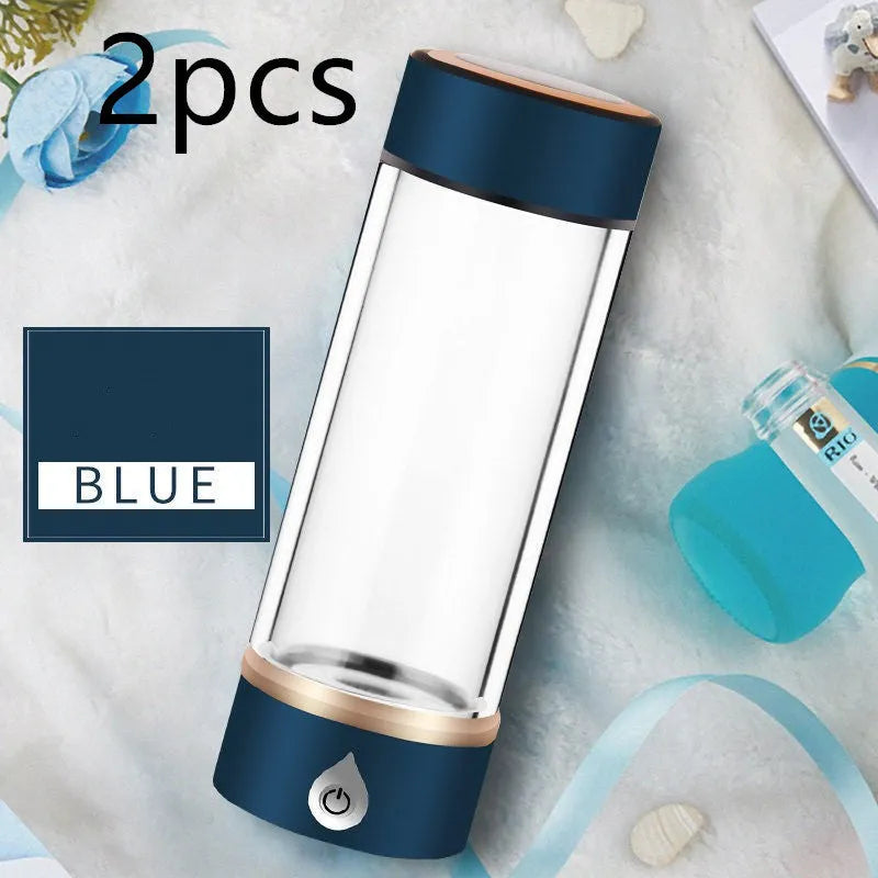 Portable hydrogen water ionizer bottle with high borosilicate glass cup in silver finish.
