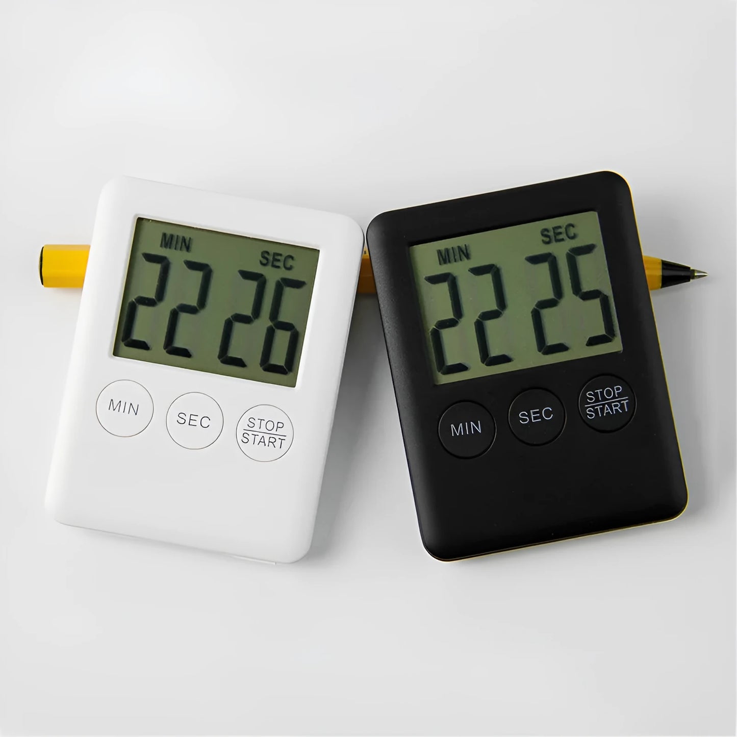 Digital kitchen timer with magnetic back showing countdown display in black or white options