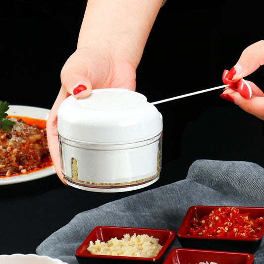 A versatile manual food chopper with self-locking blade mechanism, suitable for chopping a variety of ingredients in the kitchen.