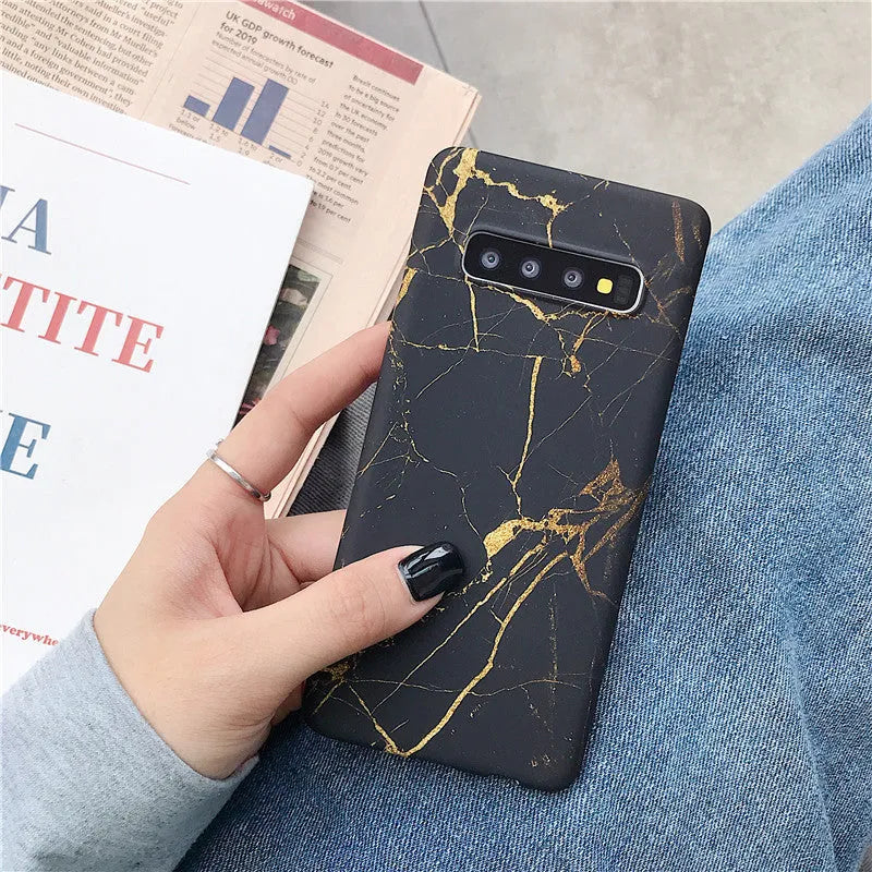 Samsung phone case with white and grey marble pattern on a polycarbonate back cover.