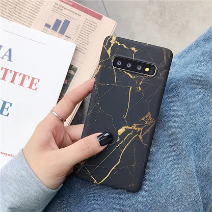 Samsung phone case with white and grey marble pattern on a polycarbonate back cover.