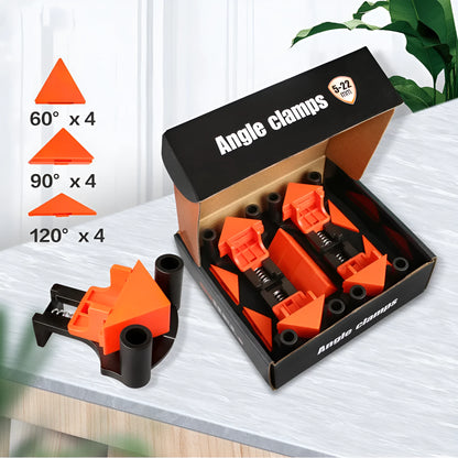 Four white plastic right angle clamps for woodworking and picture frame assembly on a workbench.