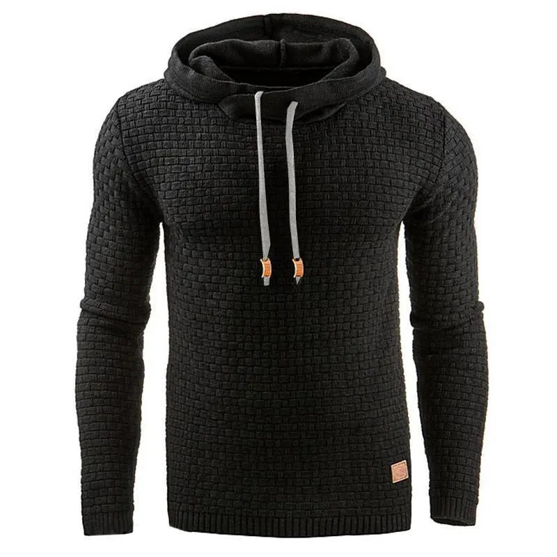 A man wearing a cotton-polyester blend hoodie available in nine colours including black, navy, and red.