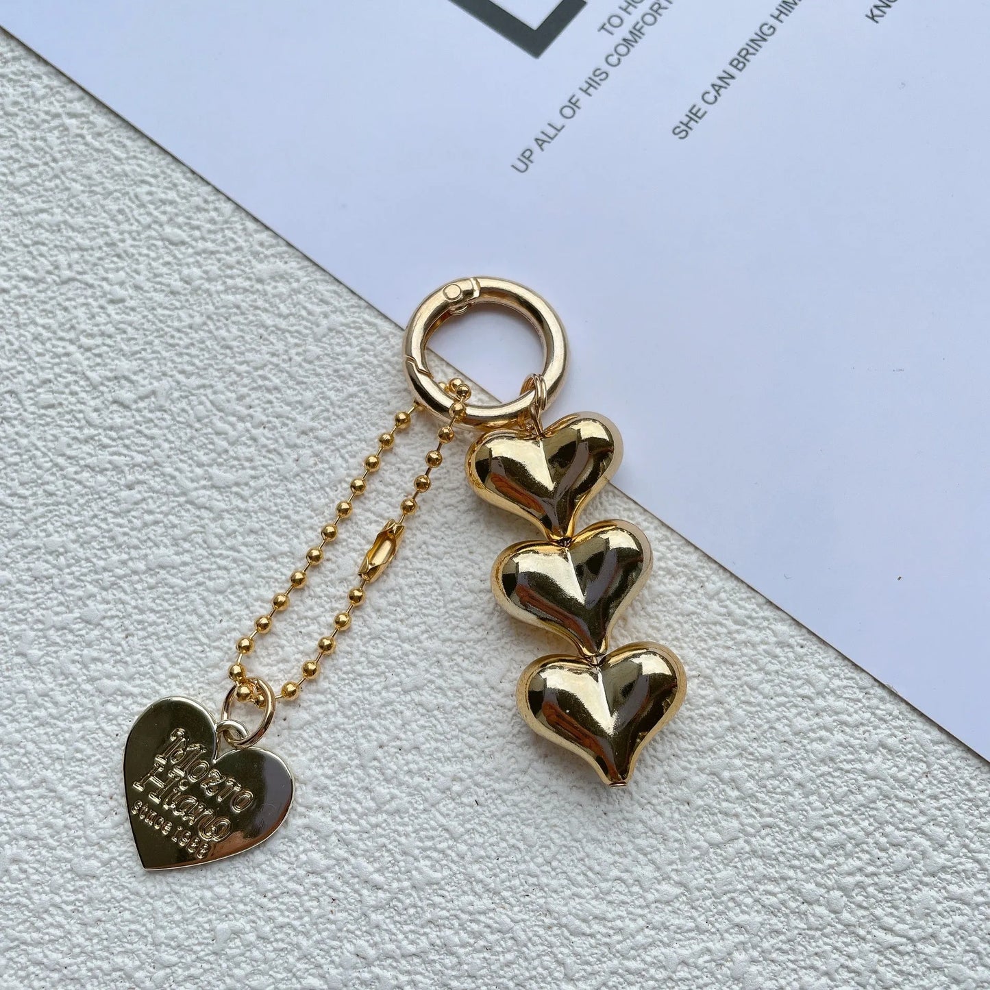 Acrylic peach-shaped key ring with love heart design and electroplated finish