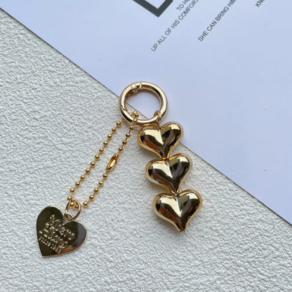 Acrylic peach-shaped key ring with love heart design and electroplated finish