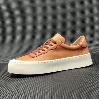 Men's white genuine cowhide board shoes with a thick rubber platform sole and round toe.