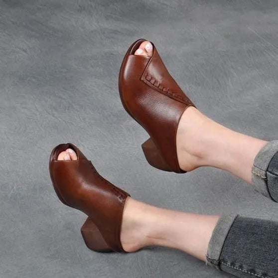 Women's black square heel peep-toe slippers with a rubber sole and fish mouth scaffold design.