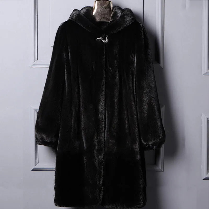 Woman wearing a long black faux fur hooded coat in a street fashion style.