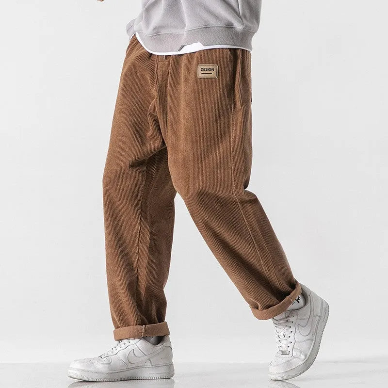 Men's loose fit corduroy sports trousers in Army Green colour with straight leg design and elasticated waist
