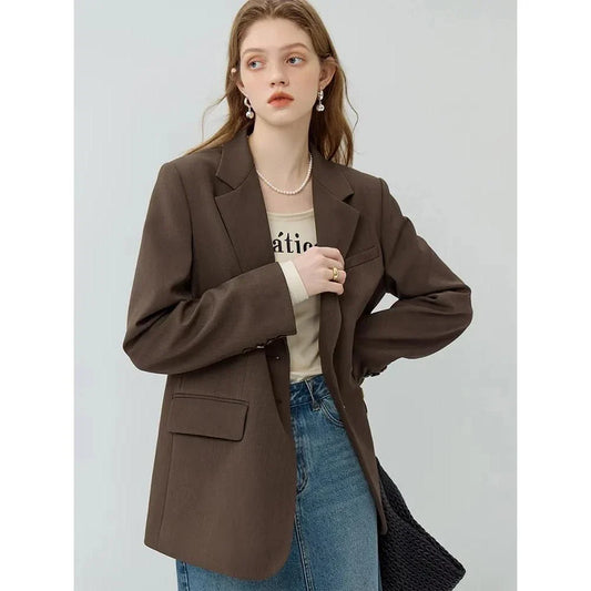 A chocolate brown blazer and matching trousers, forming a stylish and comfortable women's suit set for autumn.