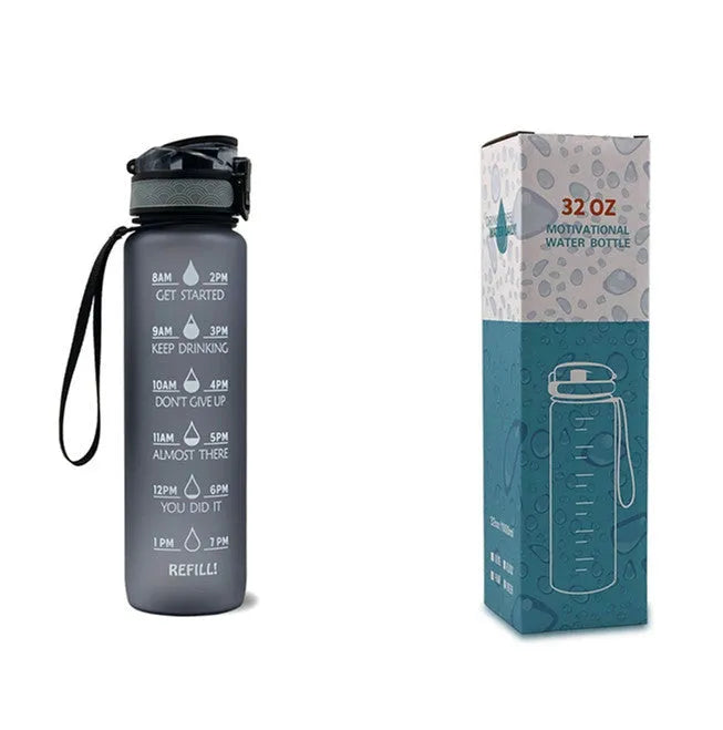 Blue and red gradient 1 litre Tritan sports water bottle with time markers and a flip-top lid.