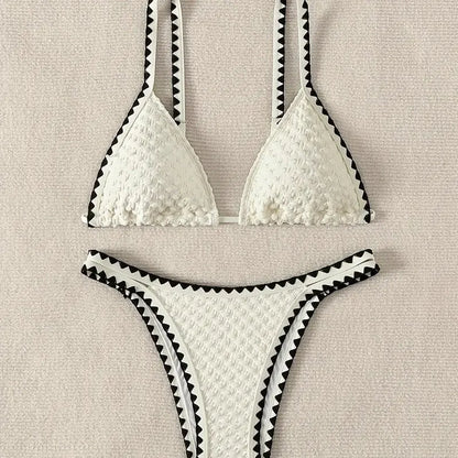 Women's blue or white two-piece bikini swimsuit with briefs style.