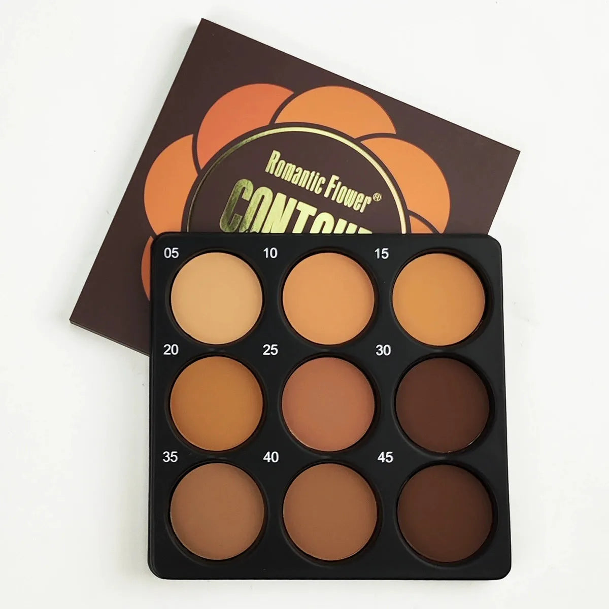 Dark matte makeup palette showing nine waterproof colours with repair disk