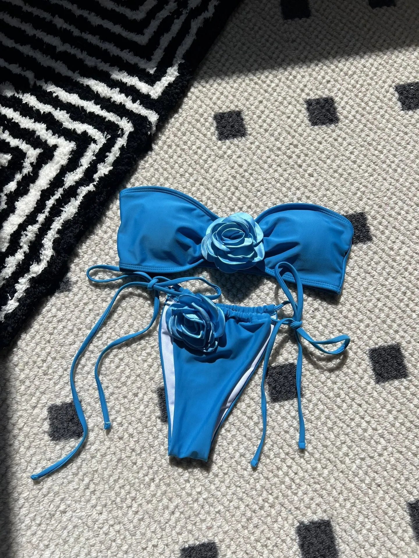 Women's solid colour drawstring tube top swimsuit in brief style, shown in one of nine available colours.