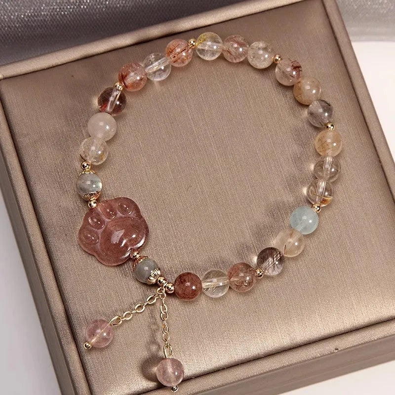Colourful hair crystal stretch bracelet with cat's paw, butterfly, flower, and purse charms on adjustable band