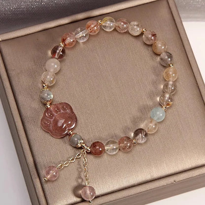 Colourful hair crystal stretch bracelet with cat's paw, butterfly, flower, and purse charms on adjustable band
