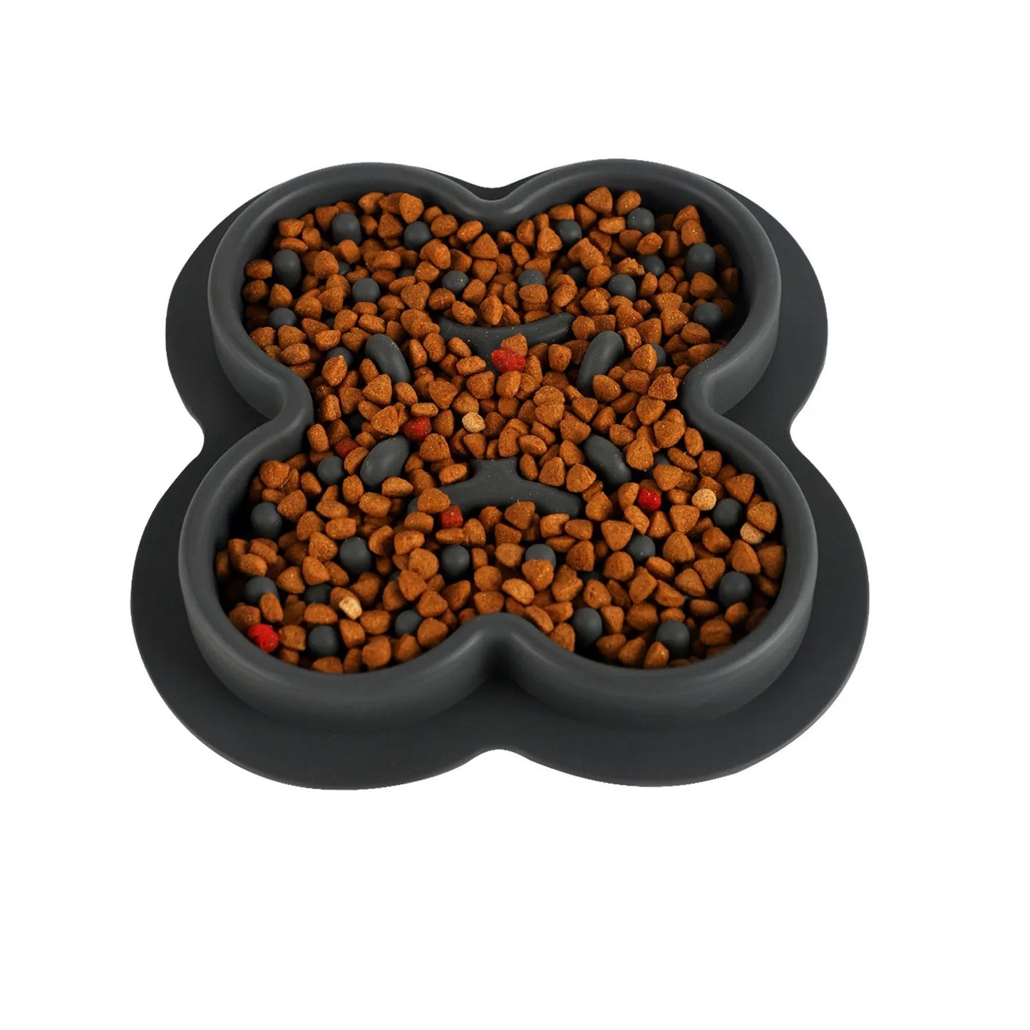 A raised silicone pet licking pad placed on a floor, showing its textured surface and non-slip base.