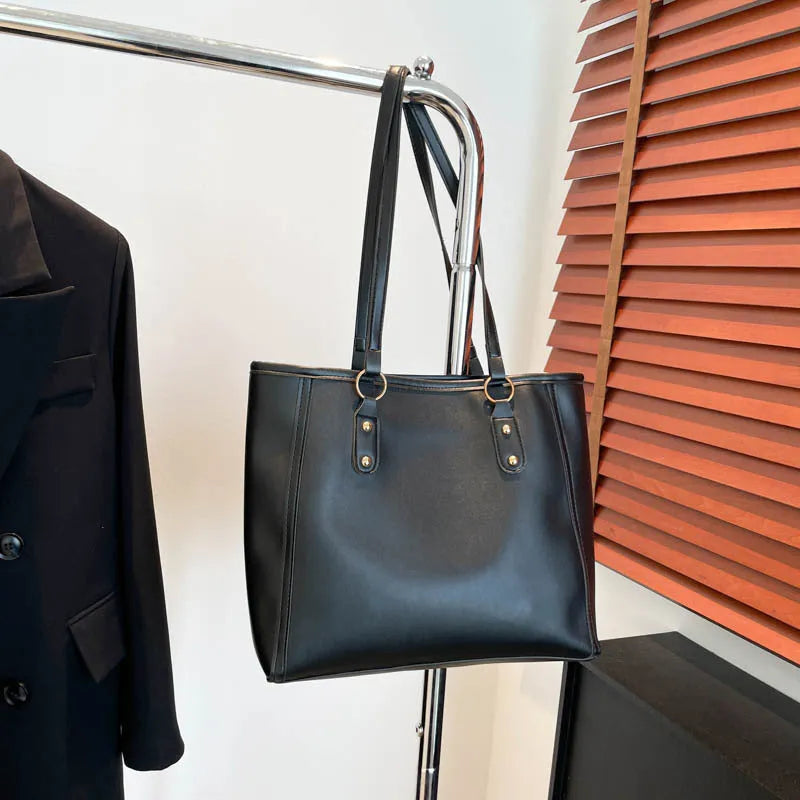 Korean style black PU leather shoulder underarm bag with a horizontal square shape and sandwich pocket.
