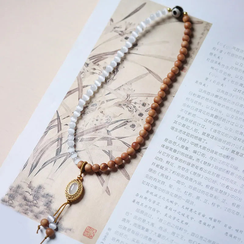 Sandalwood double ring and Opal Tibetan bead bracelet with polished finish