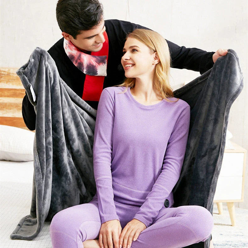 Cozy and heated plush blanket with adjustable temperature settings and soft, plush fabric for maximum winter comfort