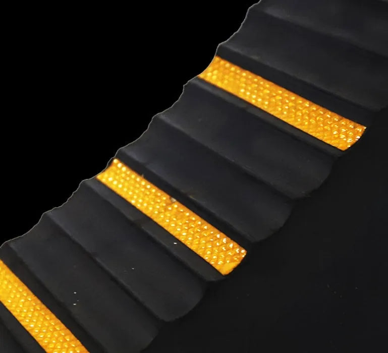 Portable car anti-slip retainer wedge with isosceles triangle design on a ramp.