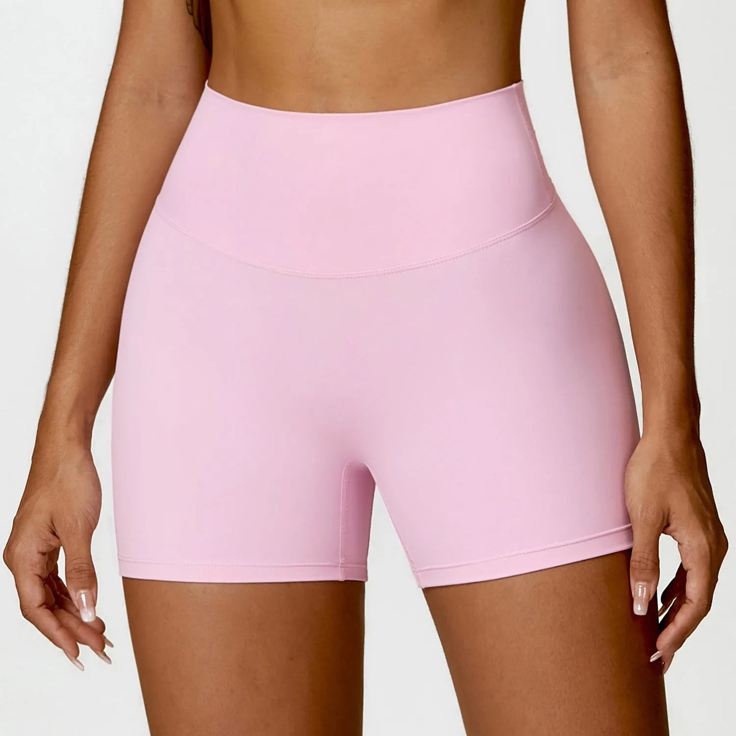 Women's high waist yoga shorts in nylon fabric with belly contracting design and hip lifting cut
